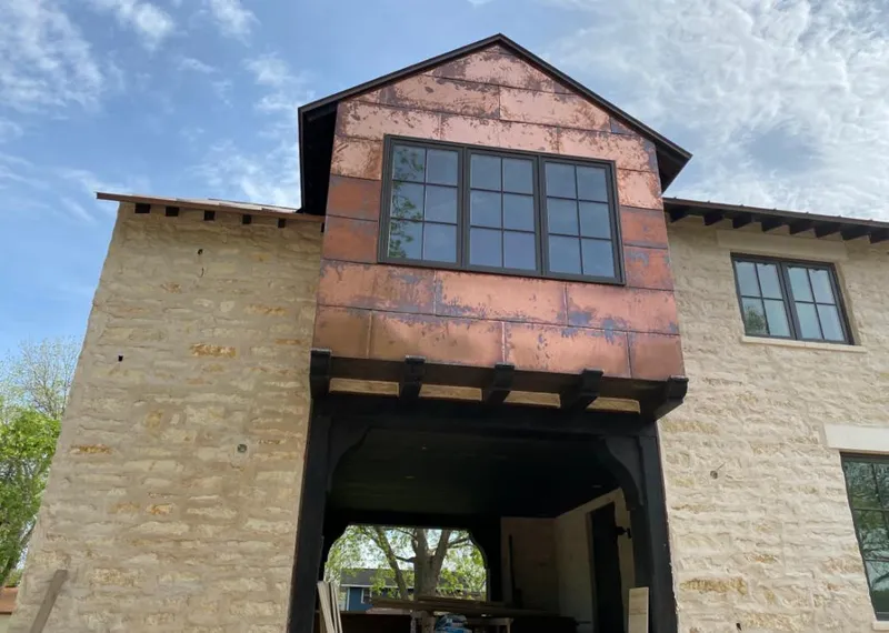 Copper metal panel facade on a stone building for Skylight Installation in Hollidaysburg